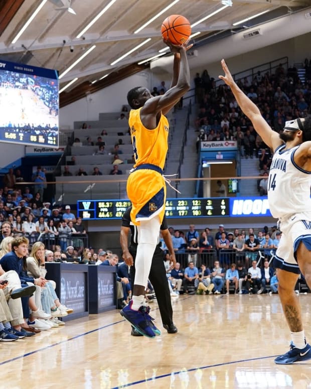 Nov 7, 2022; Villanova, Pennsylvania, USA; La Salle Explorers forward Hassan Drame (4) shoots a three point jump shot against Villanova Wildcats guard Caleb Daniels (14) during the second half at William B. Finneran Pavilion. Mandatory Credit: Gregory Fisher-USA TODAY Sports
